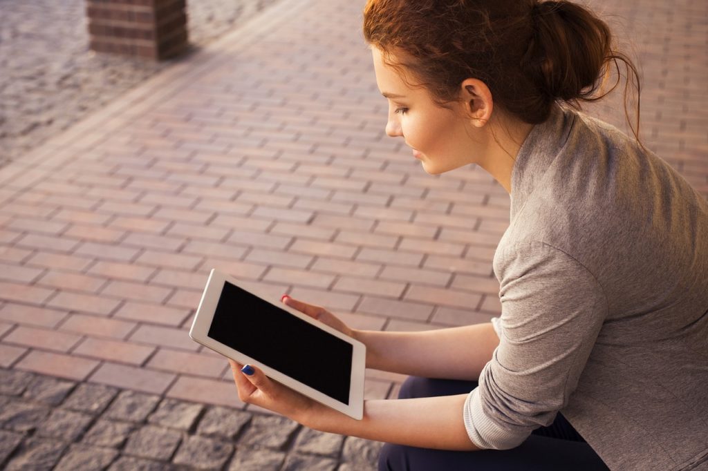 Woman Reading Tablet